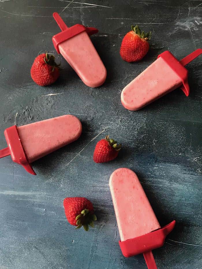 These keto friendly creamy strawberry popsicles are amazing! They are the perfect summer treat for everyone to enjoy, especially if you are on the keto diet!