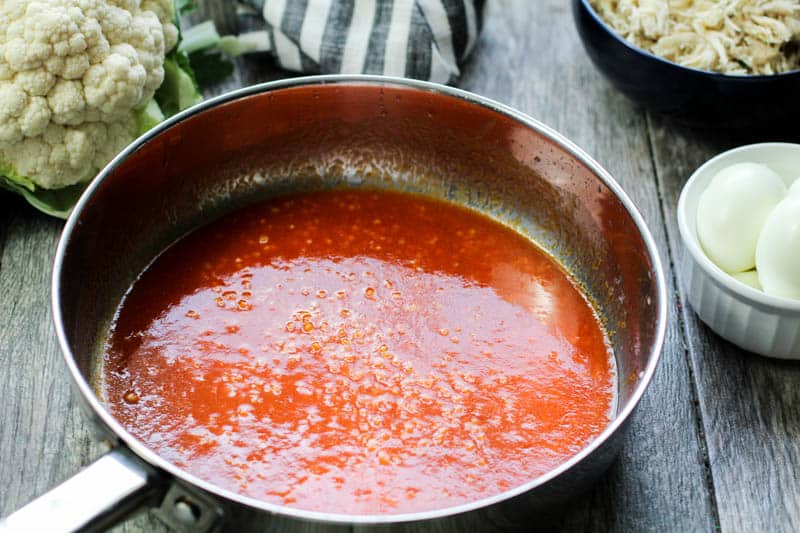 hot sauce and garlic in a pan