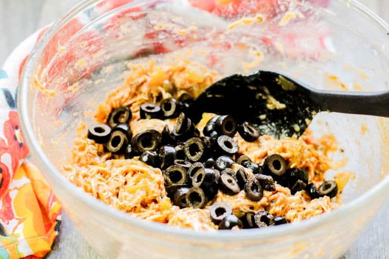 cheese and black olives in a bowl