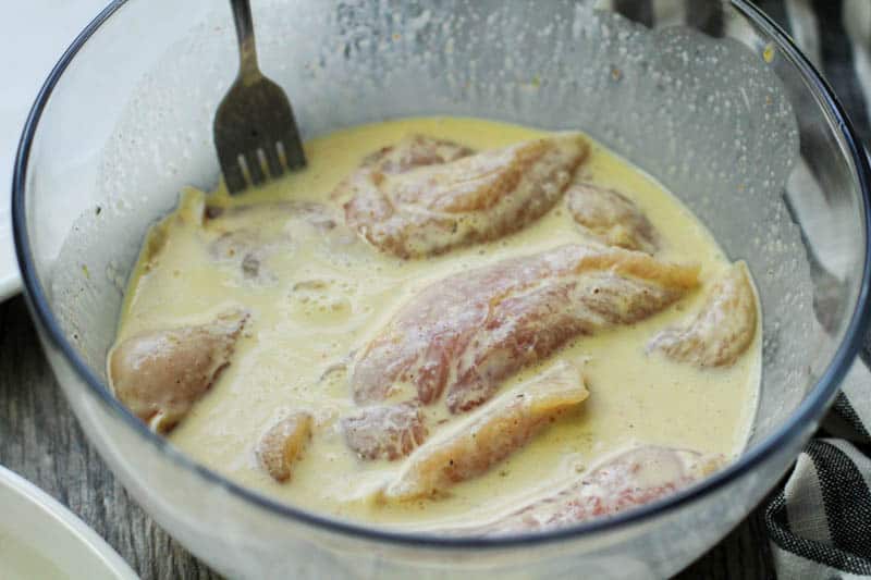 chicken tenders marinating in buttermilk