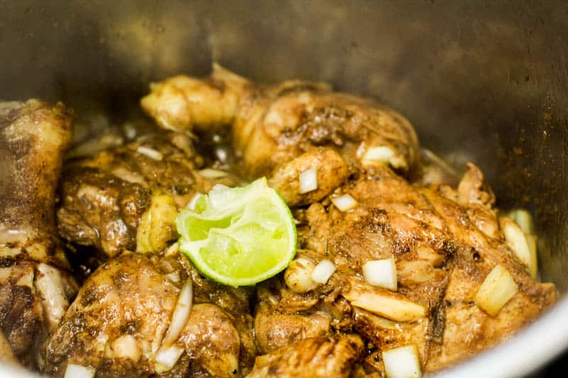 jerk chicken with a lime in an Instant Pot