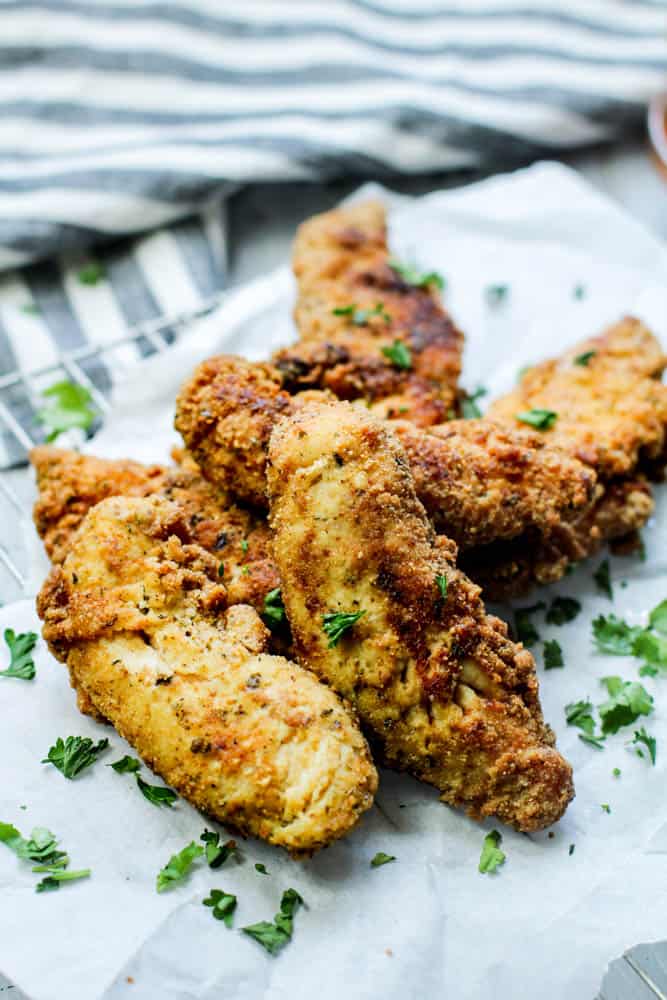 Low carb cripsy chicken tenders with parsley garnished on top