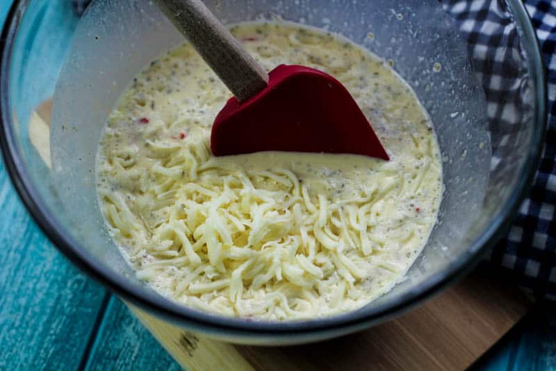 Cheese and cream mixture in a glass bowl.
