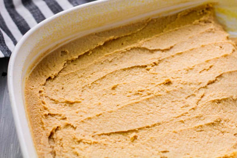 peanut butter fudge spread on a ceramic pan