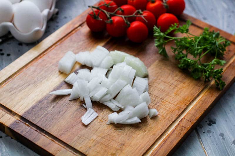 white onions on a cutting board
