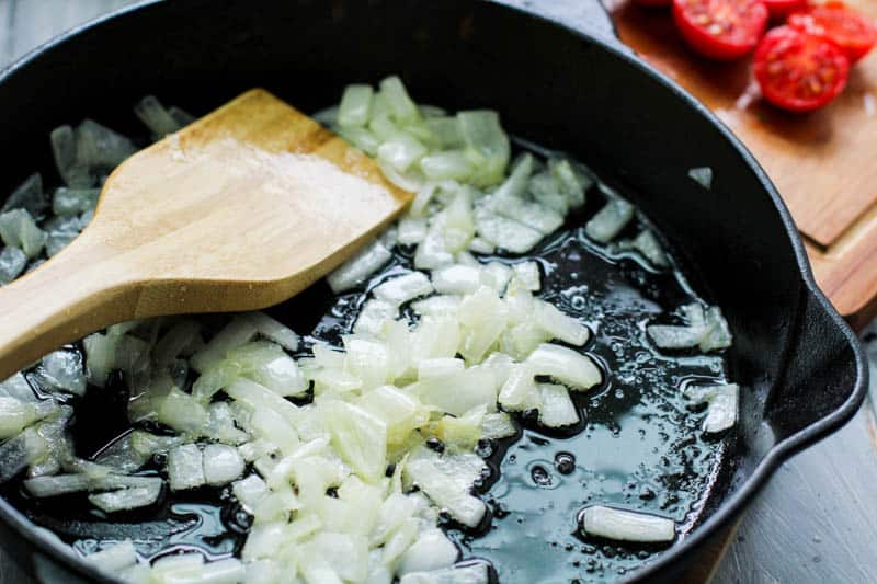 sauteed onions in a cast iron pan