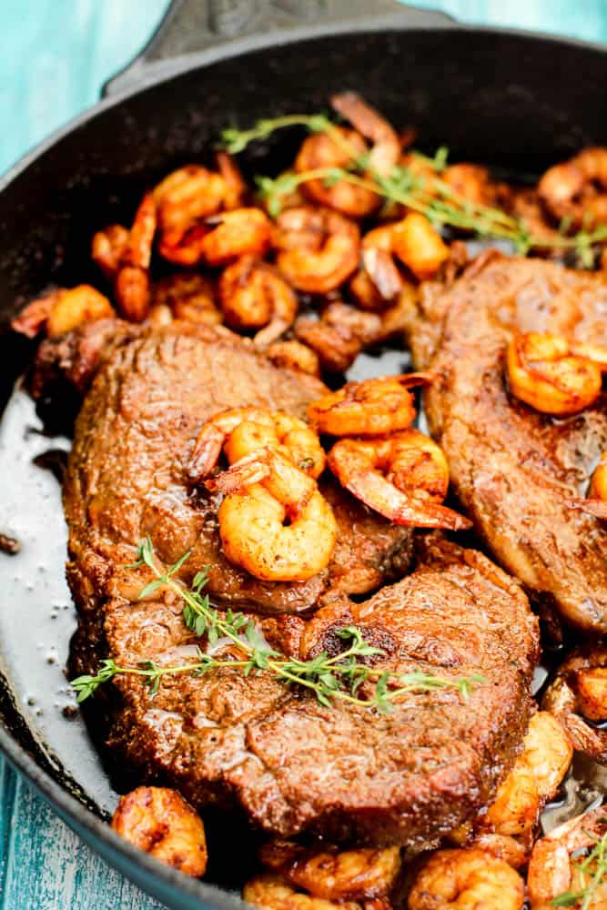 Grilled Steak with Shrimp and Bacon Butter in a pan