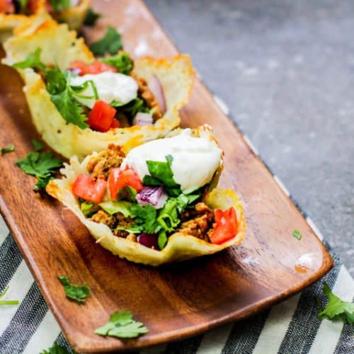 Low Carb Cheese Shell Taco Cups on a wooden tray