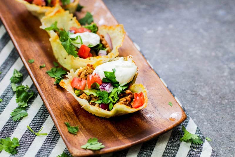Low Carb Cheese Shell Taco Cups on a wooden tray