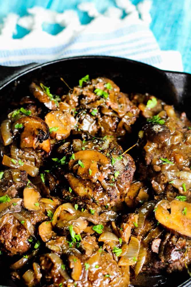 Looking for a keto friendly Salisbury steak recipe with low carb gravy? You have to try this one! The low carb gravy recipe with mushrooms and onions is delicious!
