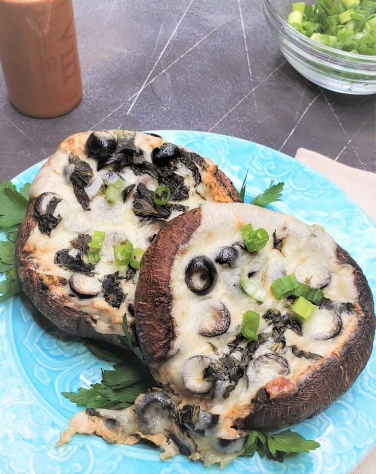 Keto Stuffed Portobello Mushrooms Recipe on a teal plate on a table