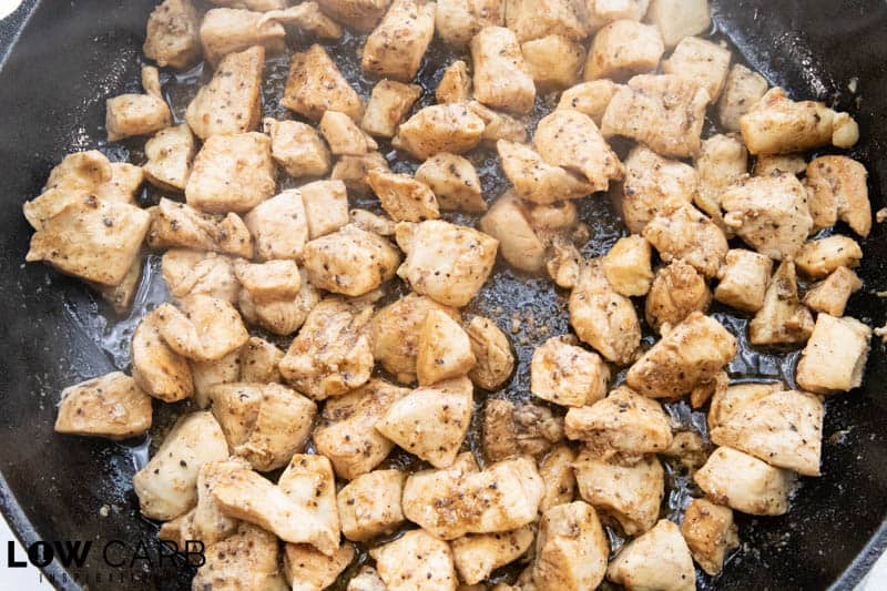 Bacon Ranch Chicken Breast cooking in cast iron skillet