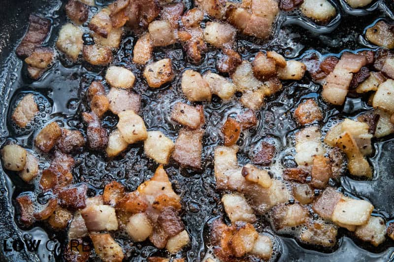 Bacon Ranch Chicken Breast cooking bacon in cast iron skillet