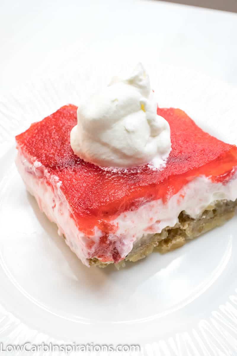 Keto Strawberry Pretzel Salad is a perfect dessert for any potluck! This keto friendly dessert uses pecans in place of pretzels to create a low-carb recipe you will love!