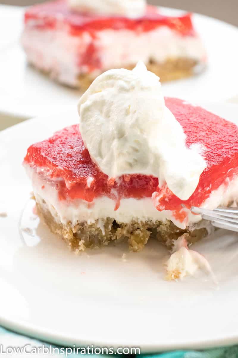 Keto Strawberry Pretzel Salad is a perfect dessert for any potluck! This keto friendly dessert uses pecans in place of pretzels to create a low-carb recipe you will love!