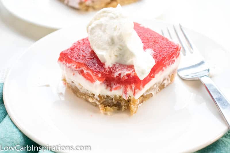 Keto Strawberry Pretzel Salad is a perfect dessert for any potluck! This keto friendly dessert uses pecans in place of pretzels to create a low-carb recipe you will love!