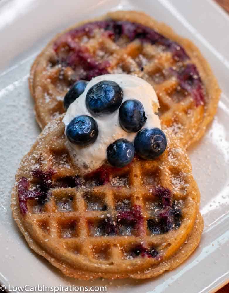 Keto Blueberry Chaffle recipe on a white plate sprinkle with keto sugar