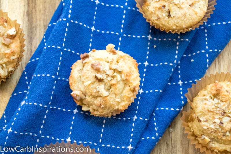 Overhead picture of a low carb banana muffin laying on top of a blue and white strapped napkin