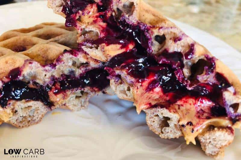 Made with cinnamon chaffle bread and blueberry compote, this Peanut Butter and Jelly Sammich Chaffle is going to make you love being on the keto diet even more!