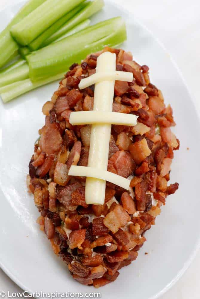 Enjoy this Keto Jalapeno Popper Cheese Ball Recipe for your next football or family gathering and watch it disappear from the plate! This delicious make-ahead appetizer is loaded with spicy jalapenos, smokey bacon and cheddar cheeses that are sure to be a hit!