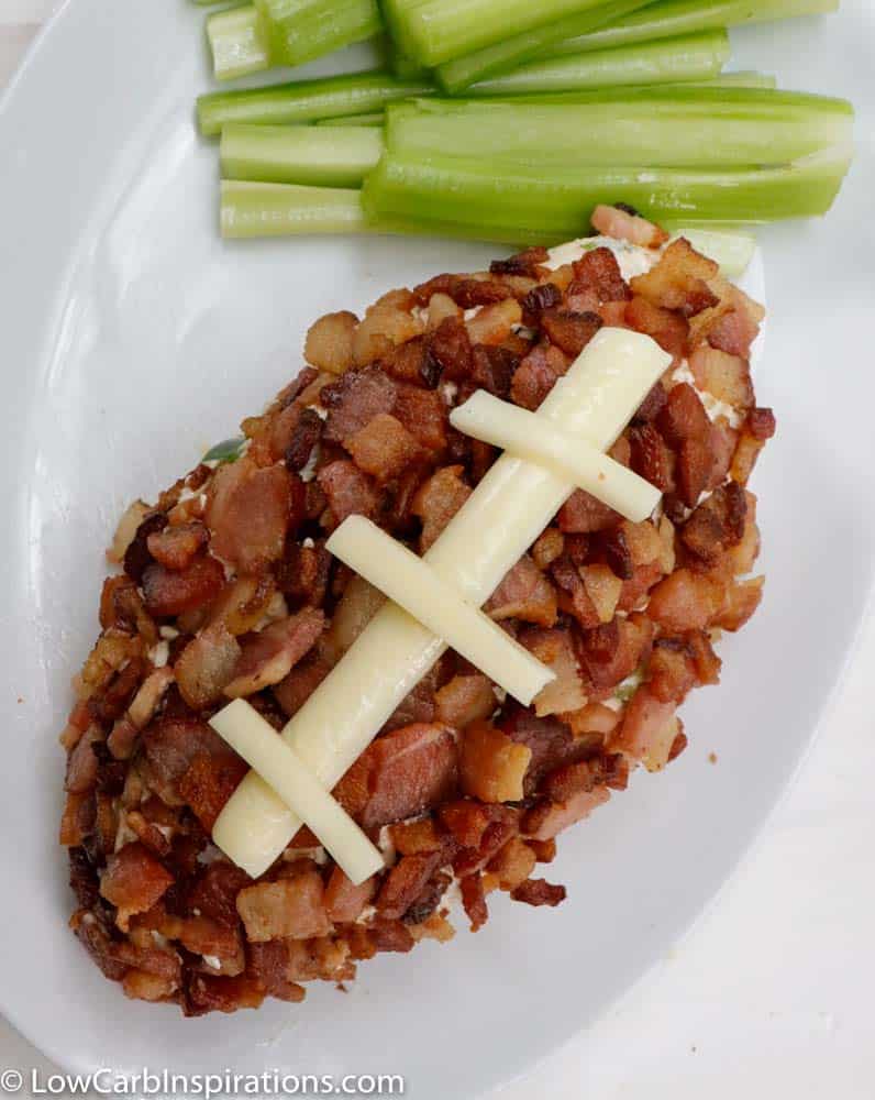 Enjoy this Keto Jalapeno Popper Cheese Ball Recipe for your next football or family gathering and watch it disappear from the plate! This delicious make-ahead appetizer is loaded with spicy jalapenos, smokey bacon and cheddar cheeses that are sure to be a hit!
