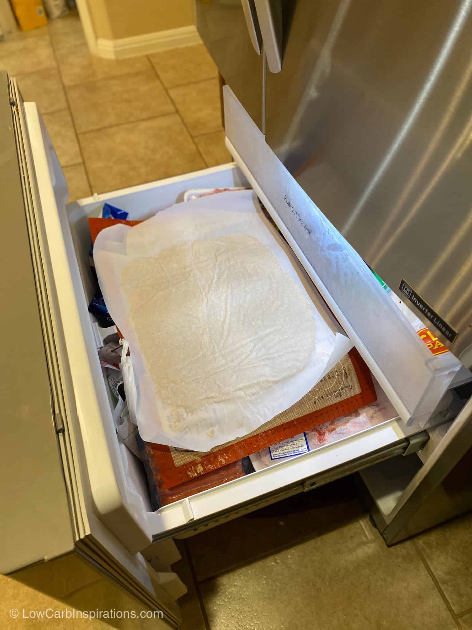 Dough being placed in the freezer to firm up