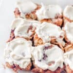Close up photo of cream cheese frosting on a keto cinnamon roll