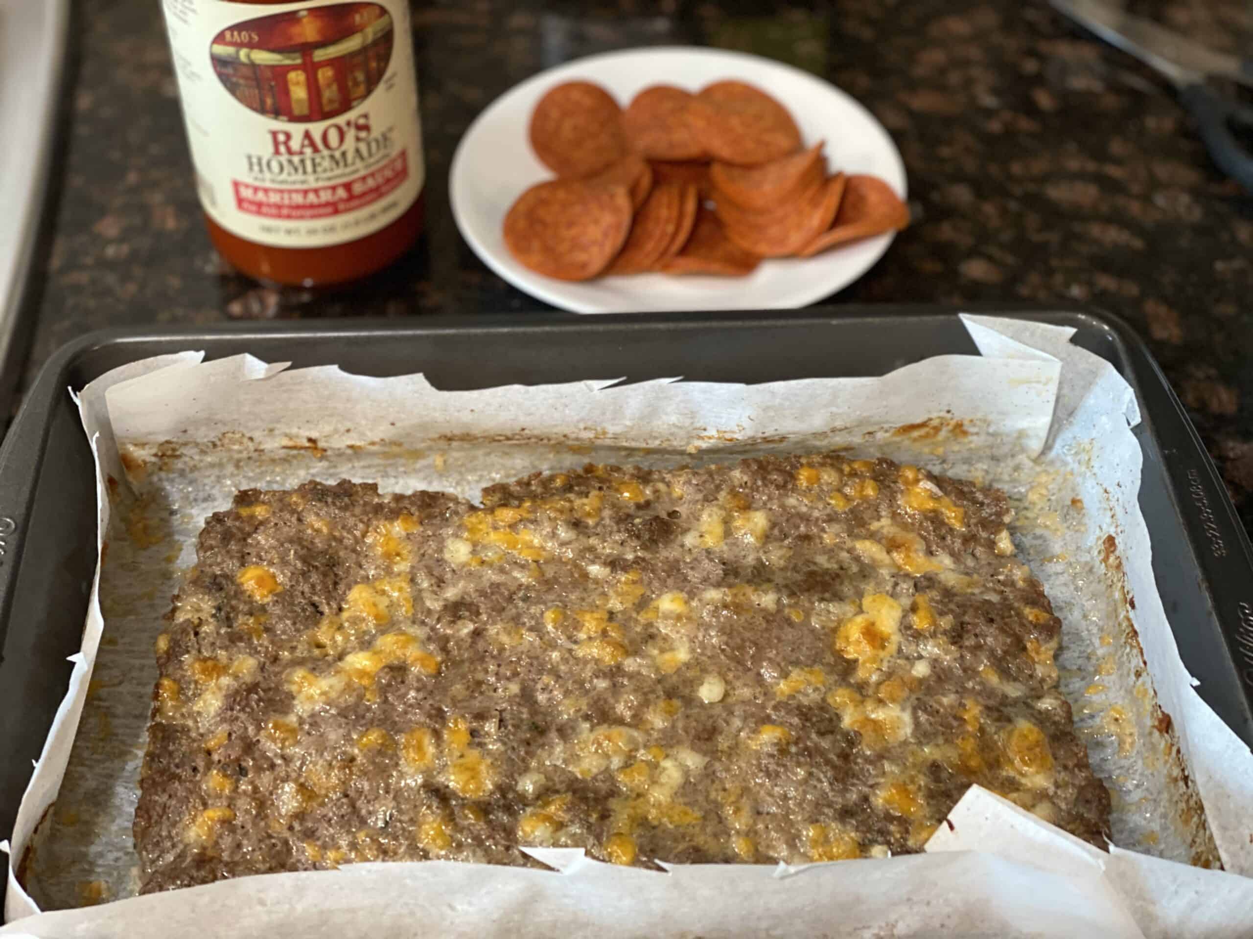 Beef and pork crust spread out on a baking sheet