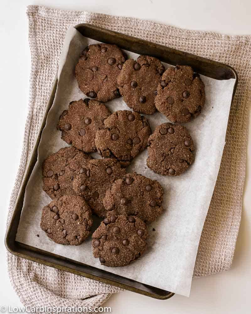 overhead photo of almond flour chocolate cookies on a baking sheet