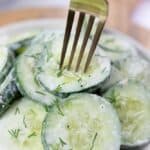 close us of healthy cucumber salad on fork