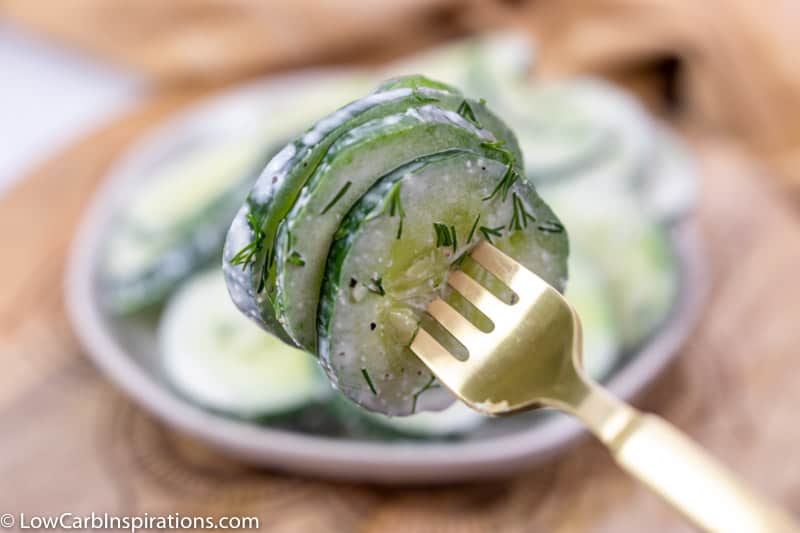 close up of cucumber salad with dill recipe on fork