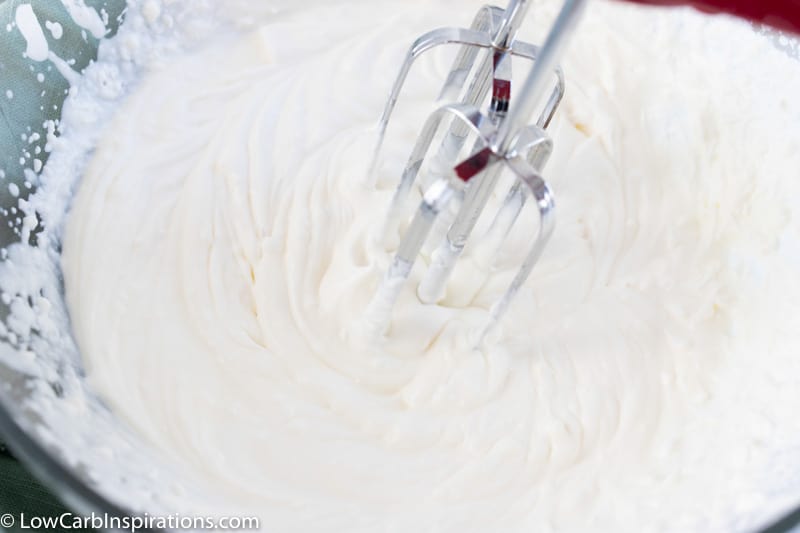 no bake lemon mousse ingredients in a bowl mixed with a hand mixer