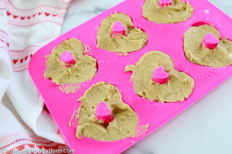 keto donuts in a heart shaped silicone mold before baking