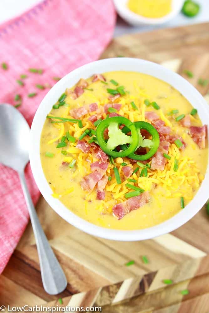 portrait close up and overhead photo of keto soup in a white bowl