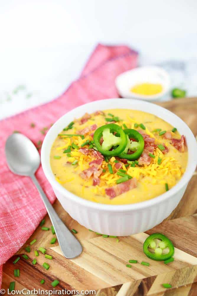Keto Bacon Cheddar Soup Recipe in a white bowl on a table ready to eat