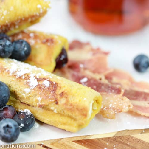 low carb blueberry breakfast roll ups with cooked bacon and blueberries