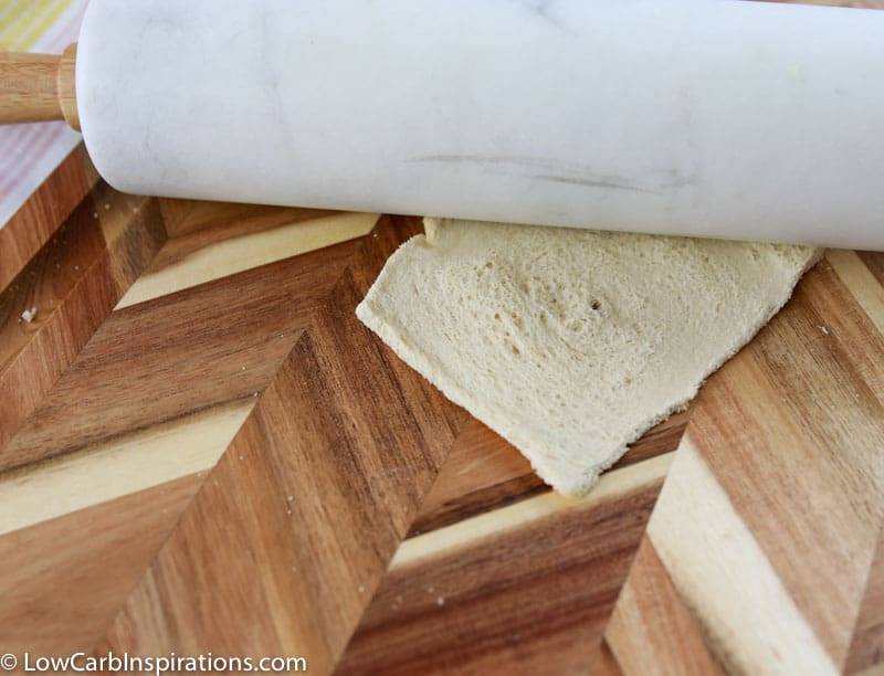 rolling out keto bread with a rolling pin