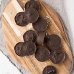 overhead photo of dark chocolate coconut bon bon recipe on a wood cutting board