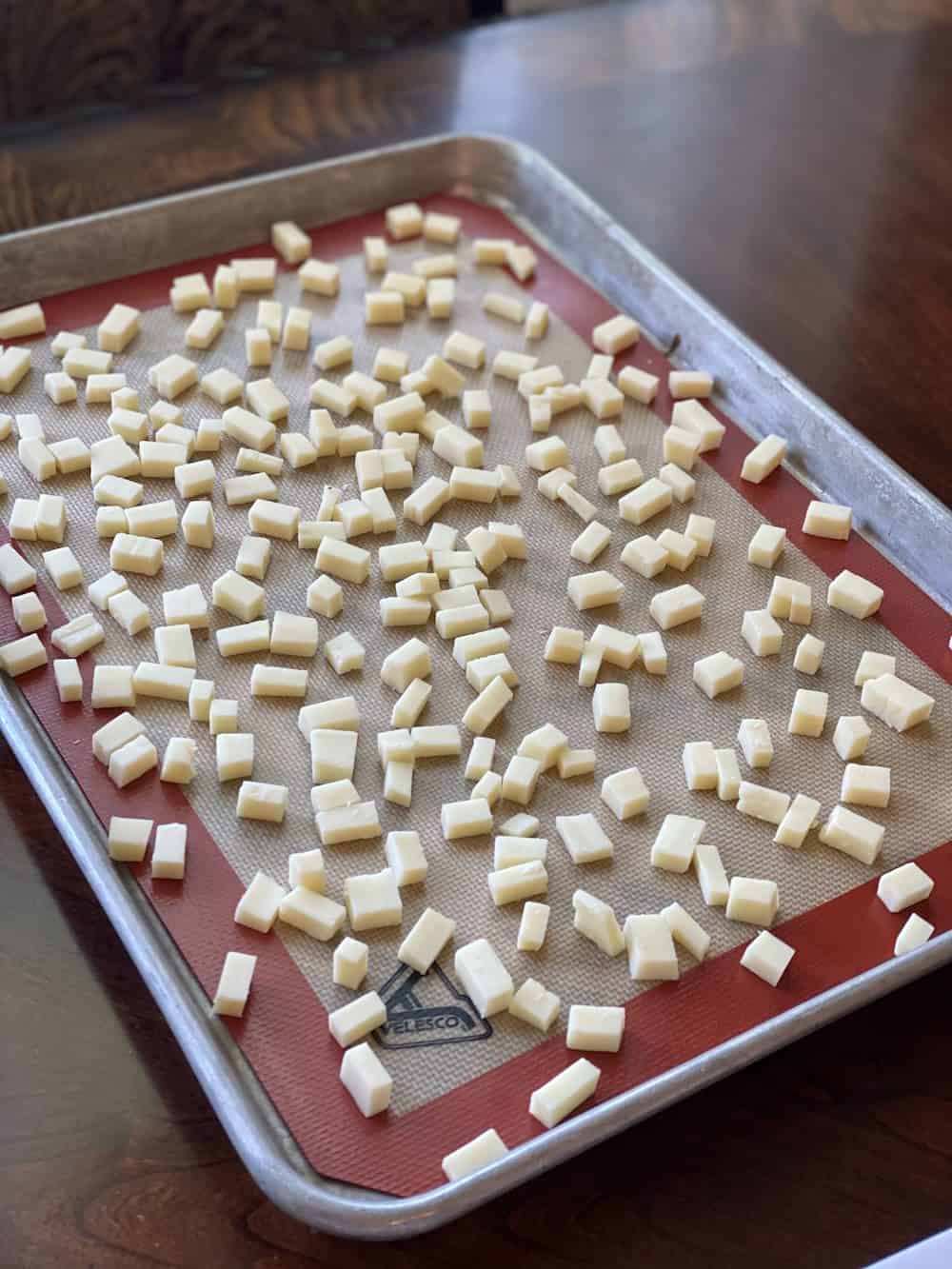 Baking sheet with popcorn on a silicone mat