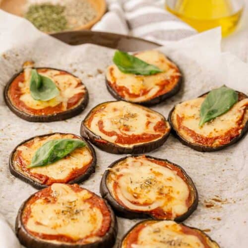 Mini Eggplant Margherita Pizza Recipe on a baking sheet with parchment paper