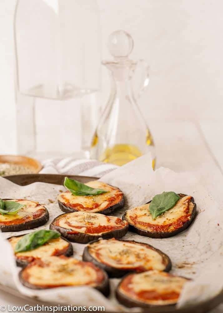 Mini Eggplant Margherita Pizza Recipe on a plate with olive oil in the background