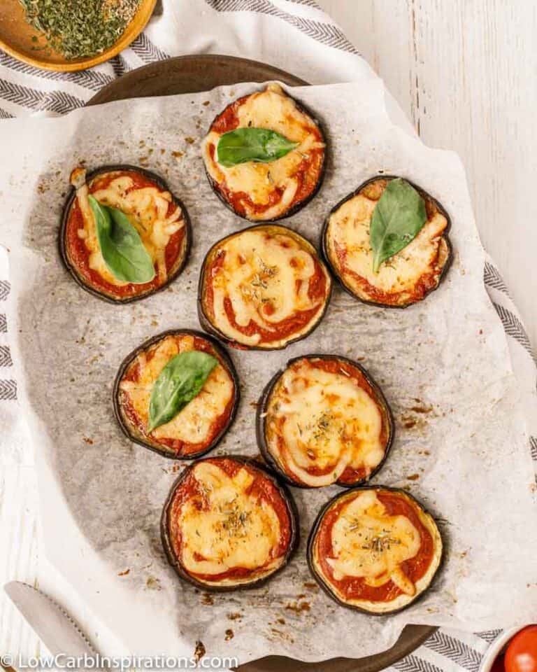 overhead photo of Mini Eggplant Margherita Pizza Recipe on a baking sheet with parchment paper