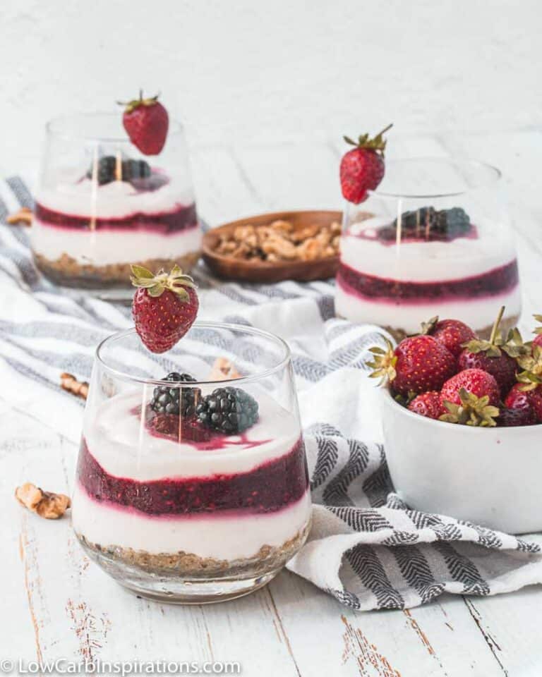 yogurt parfait recipe on a table with strawberries next to it and more parfaits in the background