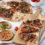 Mushroom Pizza Recipe with Cauliflower Crust on a wood serving board