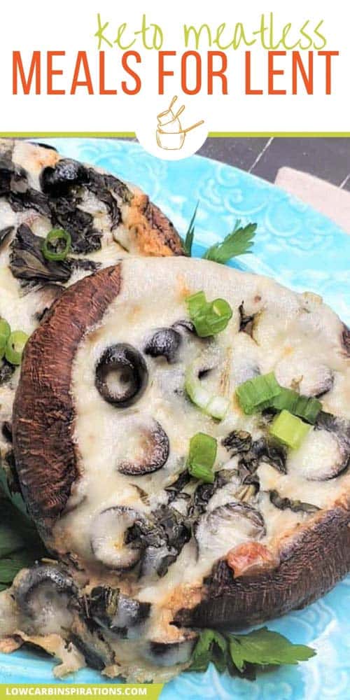 close up of stuffed portobello mushrooms on a teal plate with olives, cheese and garnishment