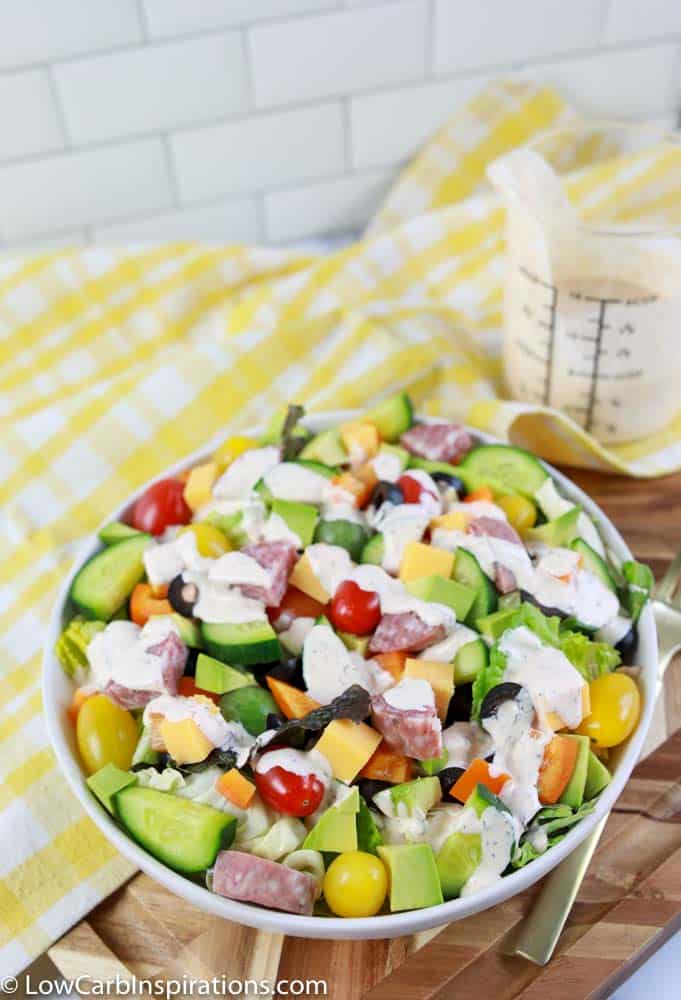 close up of keto dressing recipe on a salad with ranch salad dressing on the side