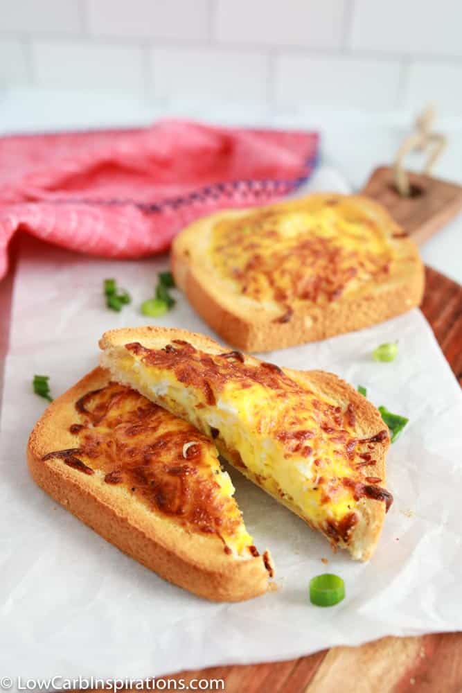 overhead photo of omelet toast recipe in an air fryer on parchment paper and cutting board