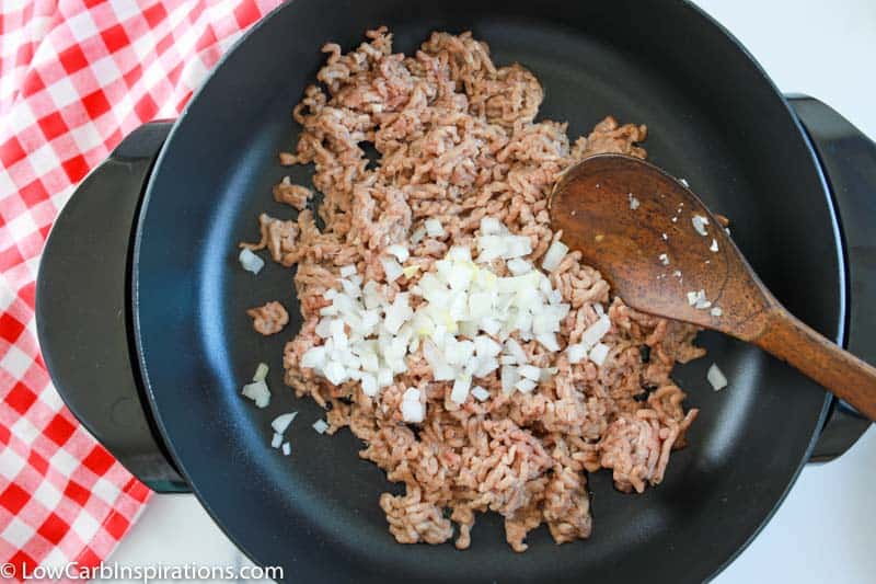 ground beef in a skillet cooking