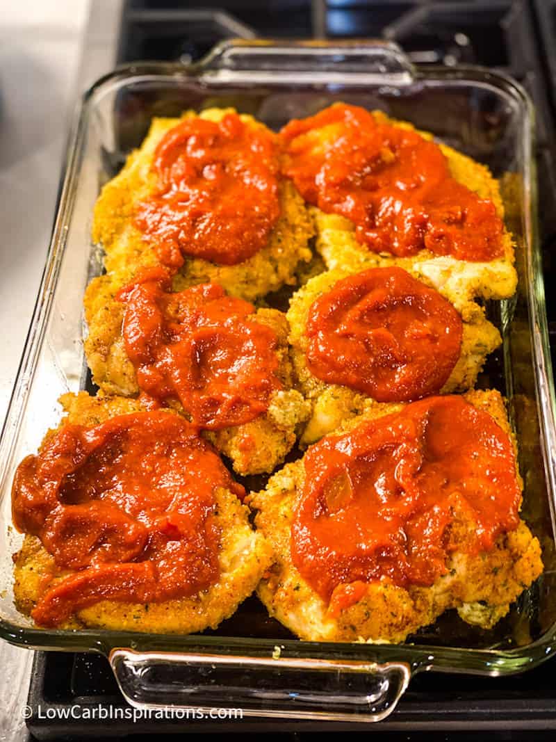 Chicken in a baking dish with red sauce