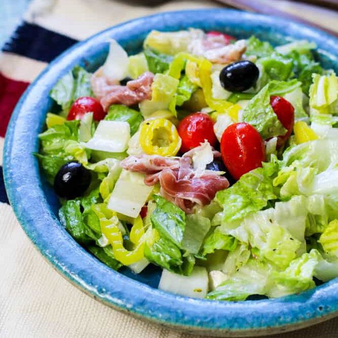 Low Carb Antipasto Salad in a teal plate